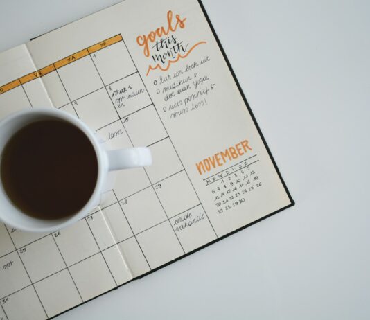 적절한 체중관리를 통한 건강관리 white ceramic mug with coffee on top of a planner