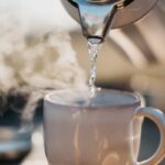 “마음챙김 루틴, 한국인의 일상 속으로…정신건강 관리의 새로운 흐름” a glass pouring water into a cup