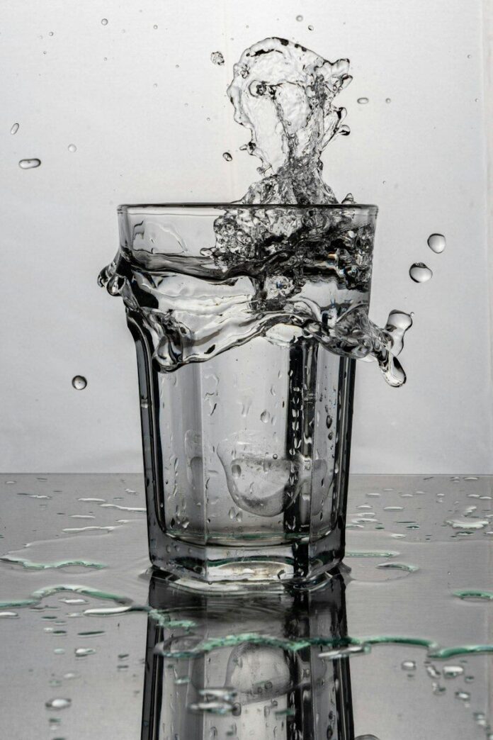 Photo by Nicolas Ruiz clear drinking glass with water